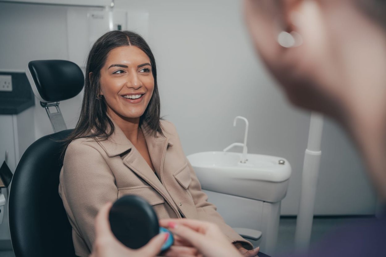 Patient talking with a dentist in the treatment room